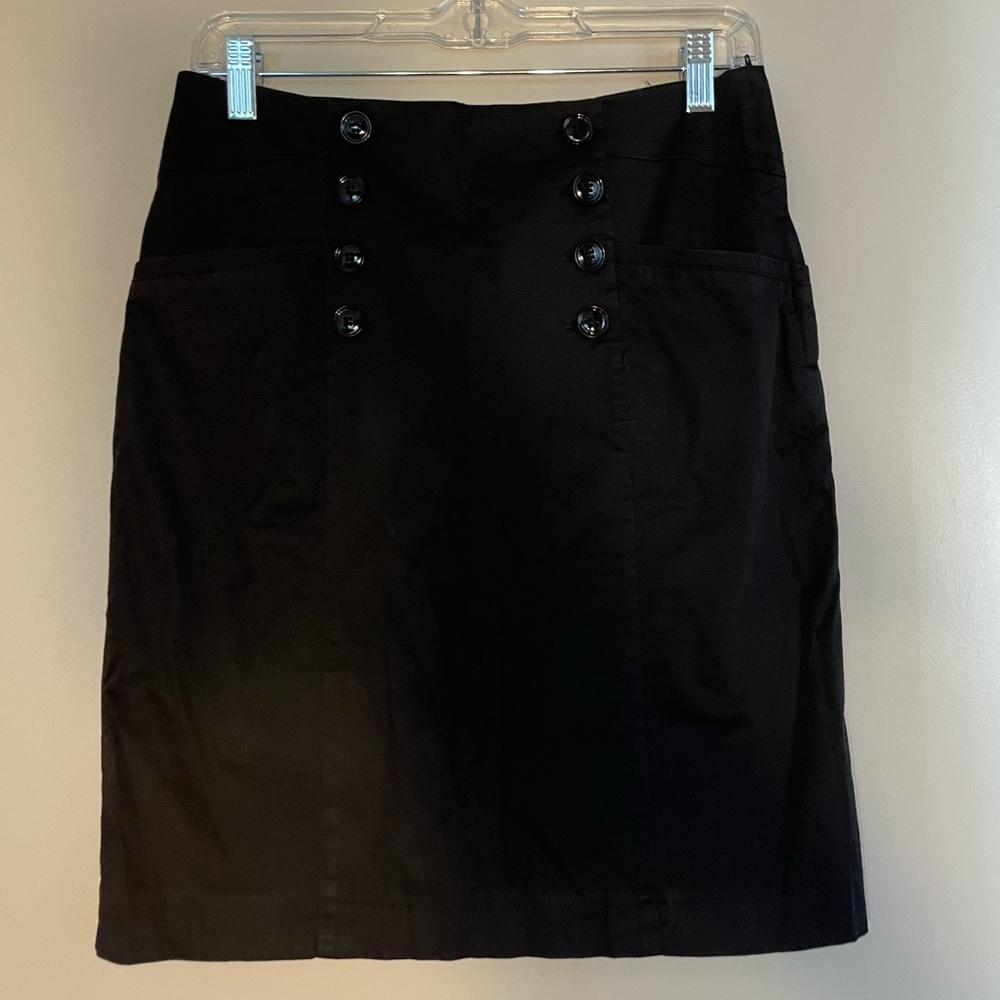 Beautiful black pencil skirt with statement buttons and pockets.